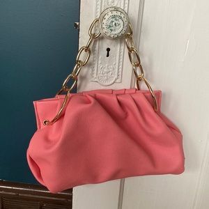 House of Want pink vegan clutch